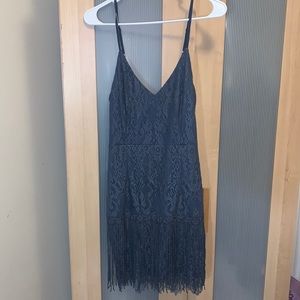 Never worn tags still attached. Two sisters the label size 4. Open back.